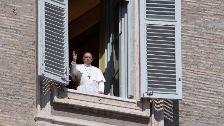 Pope Francis gives his blessing overlooking St Peter's Square