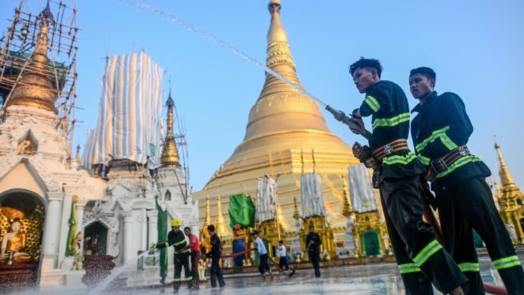 Firefighters disinfecting the Shwedagon Pagoda compound in Yangon.  