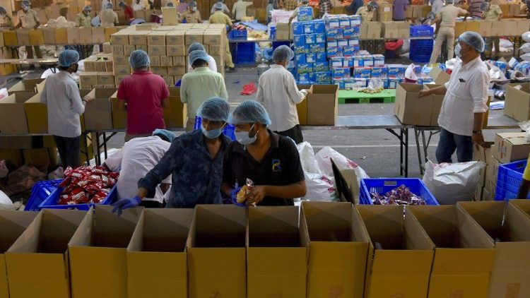 Volunteers sort essentials and groceries for the needy in Bangalore,  during India's lockdown. 