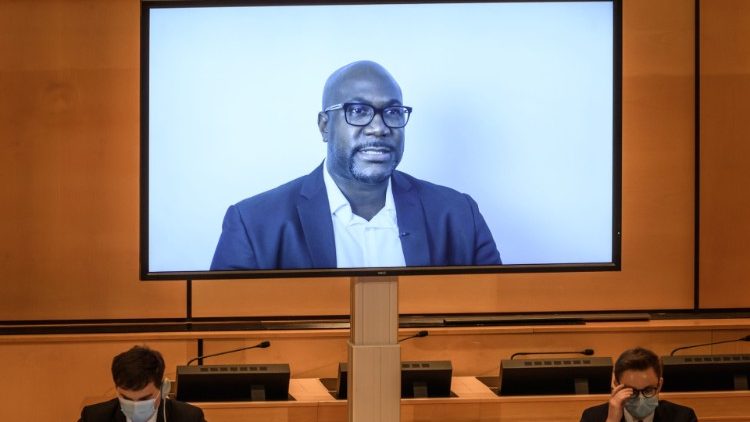 A TV screen displays Philonise Floyd during his video message to the UN Human Rights Council
