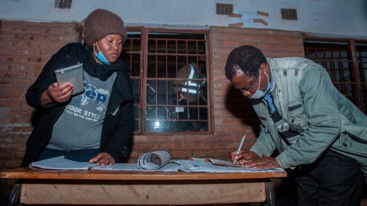 Malawi Election: Political party monitors take record of the closing time of voting 