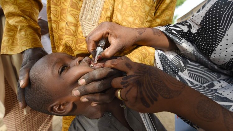 File photo of a health worker administering a polio vaccine to a Nigerian child