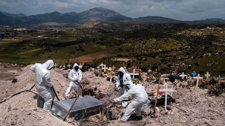 Cemetery workers bury an unclaimed Covid-19 victim at the Municipal Cemetery in Tijuana, Baja Califormia state, Mexico