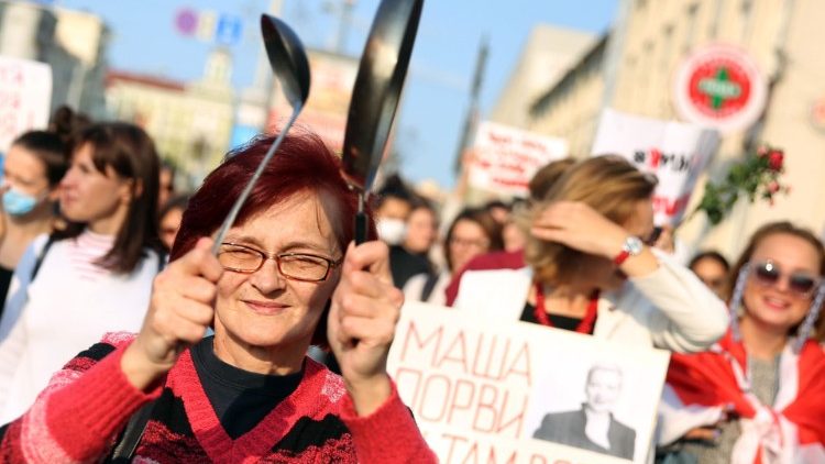 Women parade through the streets of Minsk to protest contested presidential election results