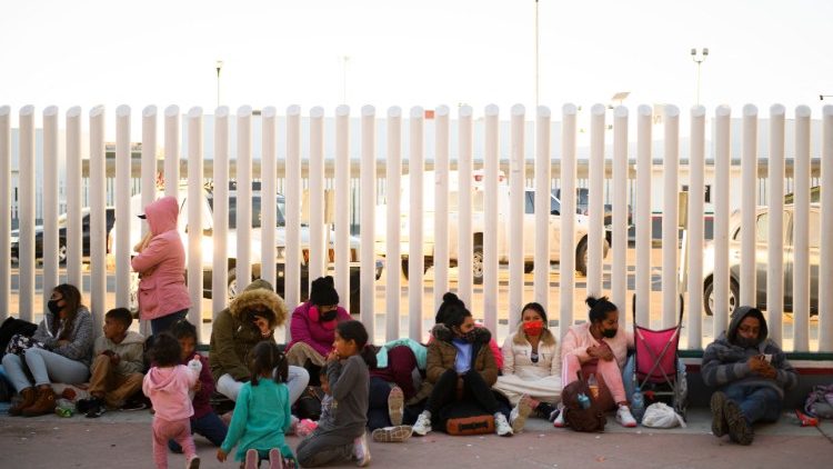 Asylum seekers wait outside the El Chaparral border crossing port hoping to cross into the United States