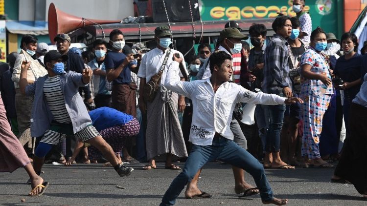 Pro-military supporters throw rocks at residents in Yangon