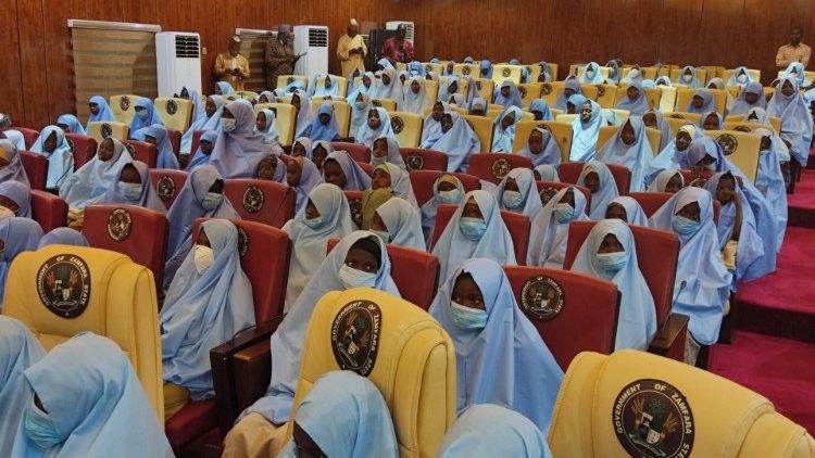 Schoolgirls who had been kidnapped from their boarding schools arrive at the Government House in Gusau, Zamfara State, following their release
