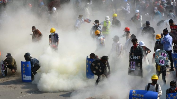 Protesters amid tear gas fired by police in the northwestern town of Kale on March 2, 2021.