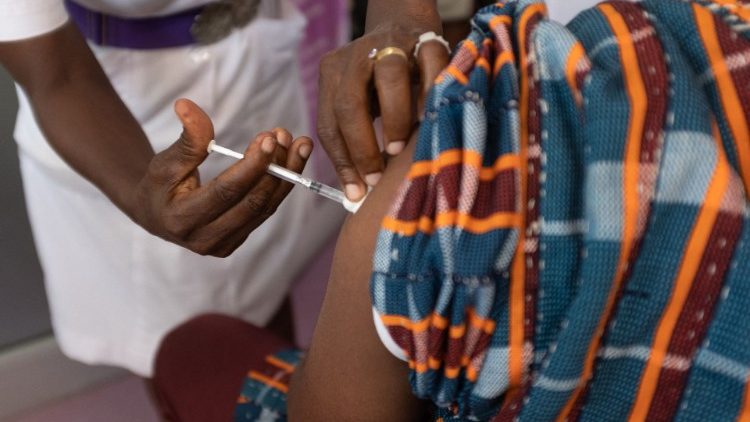 A man recieves a Covid-19 vaccine from a health worker in Accra, Ghana