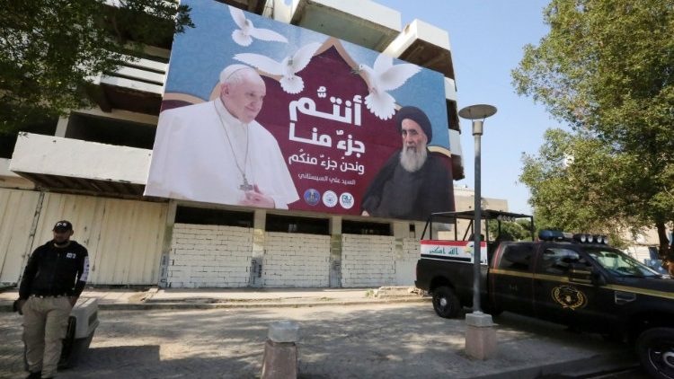 A billboard in Baghdad depicts Pope Francis and Ayatollah Al-Sistani