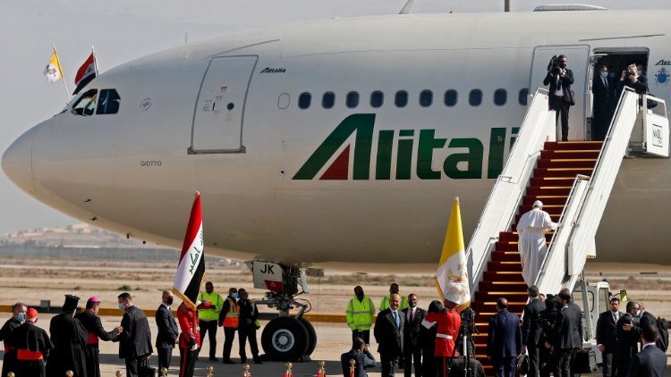 Pope Francis boards an Alitalia aircraft as he departs from Iraq on Monday morning
