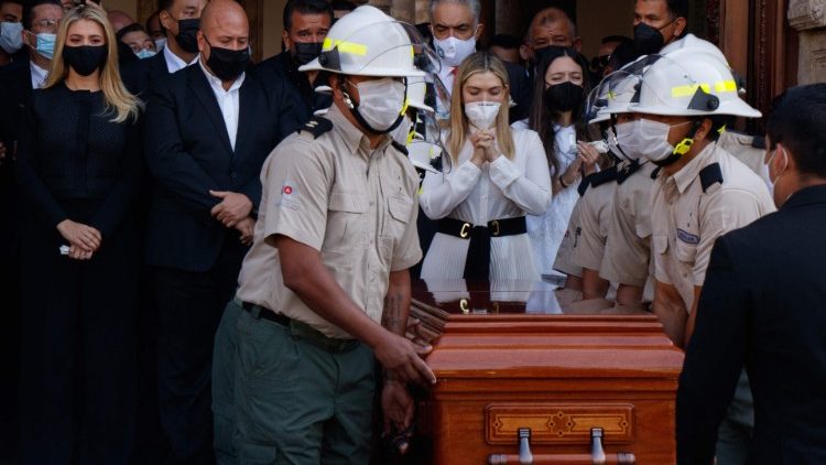 Relatives mourn over the coffin of the former governor of Jalisco state who was murdered in December 2020