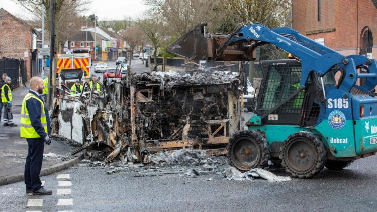 Remains of a burnt out bus in Belfast following a night of violence