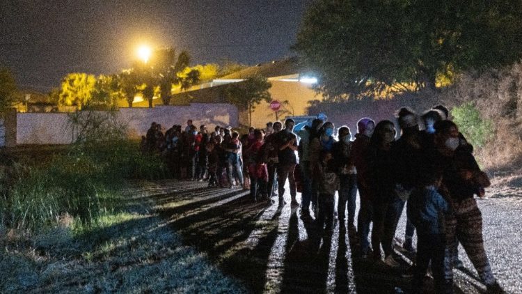 Migrants waiting to be processed by US border officials after crossing into Texas From Mexico