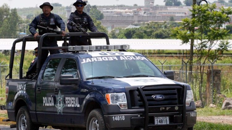 Mexican Federal Police patrol an area where drug cartels operate