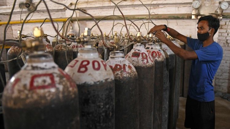 Oxygen cylinders for hospitals are being sorted at a facility outside Amritsar, India. 