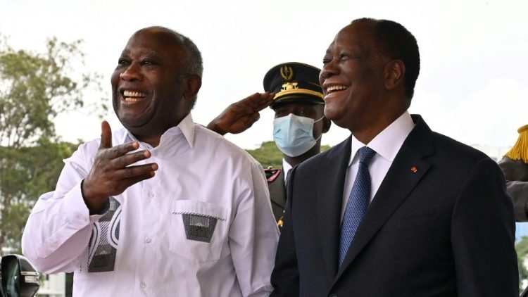 Former Cote d’Ivoire President, Laurent Gbagbo gestures towards current President, Alassane Ouattara.