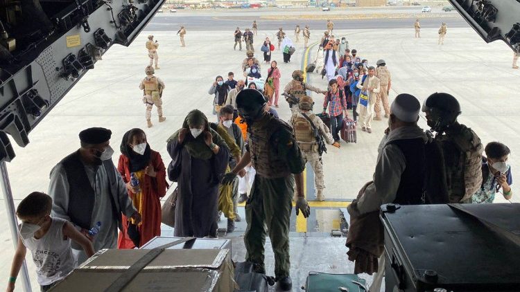 Spaniards and Afghanis board a Spanish Air Force flight out of Afghanistan