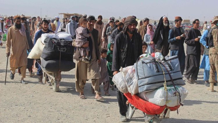 Afghans arrive at the Pakistan-Afghanistan border crossing at Chaman.