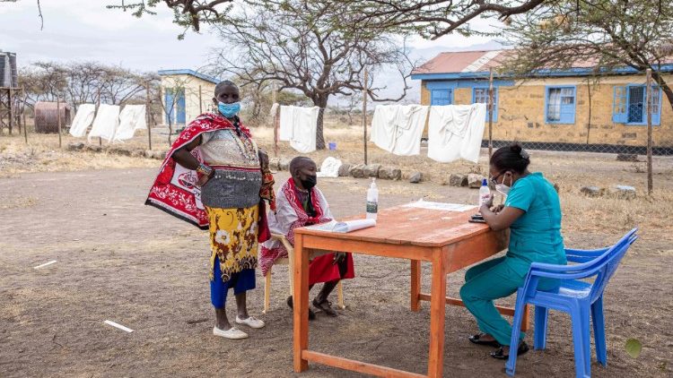 Two Maasai women are registered for the Covid-19 vaccine in Kajiado, Kenya