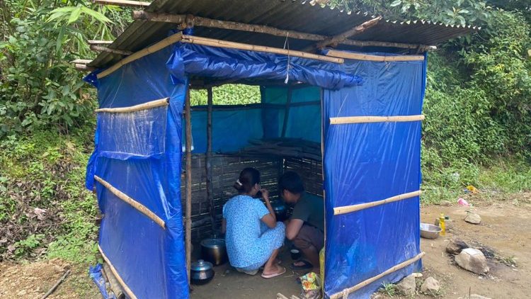 Myanmar villagers fleeing military attacks seek refuge in basic shelters at Farkawn in India's Mizoram state near Myanmar border.