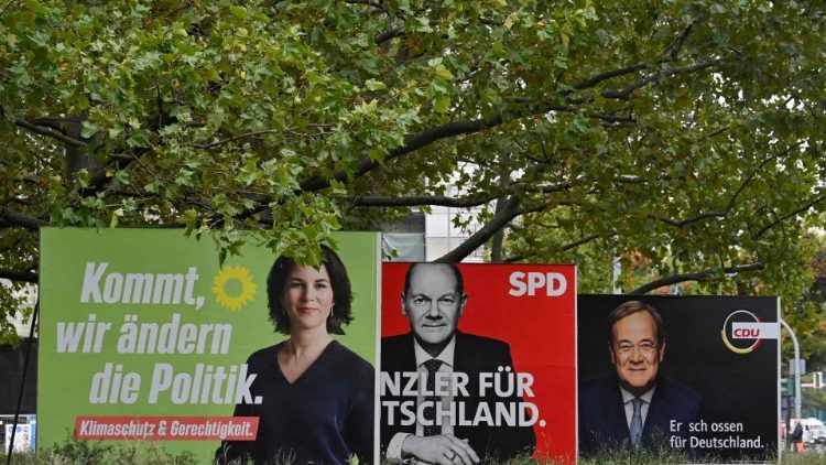 Billboards show the three chancellor candidates in Germany's election