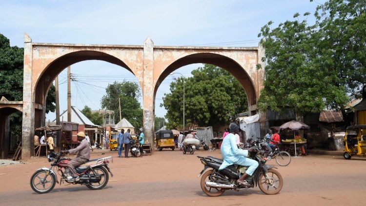 Residents drive past a city gate in Sokoto, northwest Nigeria