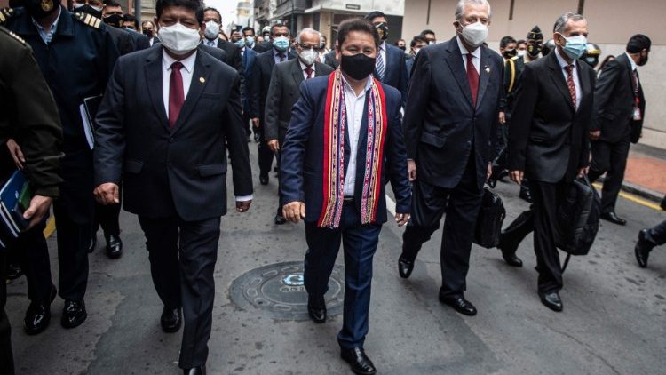 A file photo of Guido Bellido and his cabinet ministers walking to Congress to ask for a vote of confidence in Lima on 26 August