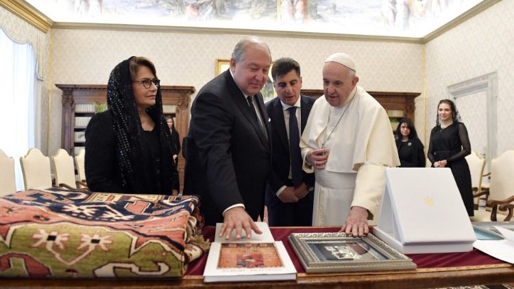 Pope Francis and President Sarkissian exchange gifts during their meeting on Monday