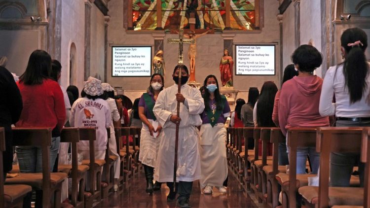 Filipinos attend Mass at the Catholic Church of the Holy Cross in Nicosia