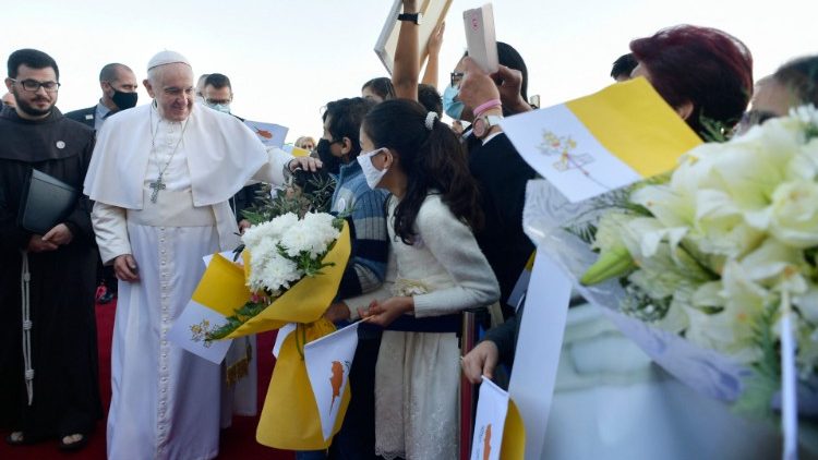 Pope greets children at Larnaca airport.