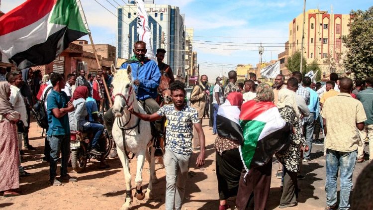 Sudanese demonstrators rally in al-Daim neighbourhood in the capital Khartoum on 2 January, 2022, amid calls for pro-democracy rallies in "memory of the martyrs" killed in recent protests. 