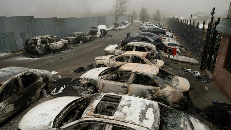 Burnt-out cars litter the streets of Almaty in Kazakhstan