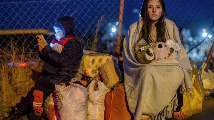 Profughi al confine con la Polonia