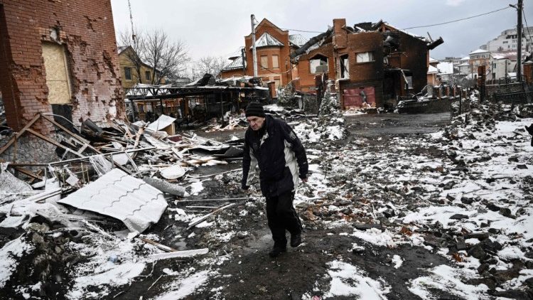 A man walks between houses destroyed during air strikes on the central Ukranian city of Bila Tserkva on March 8, 2022