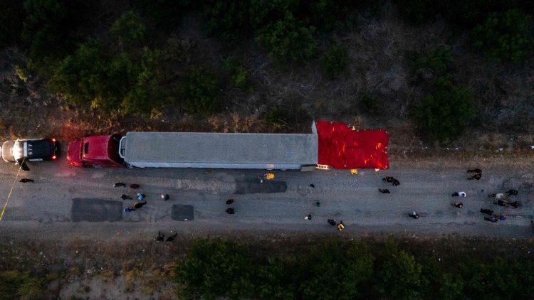 An aerial view of members of law enforcement investigating a tractor trailer in San Antonio, Texas
