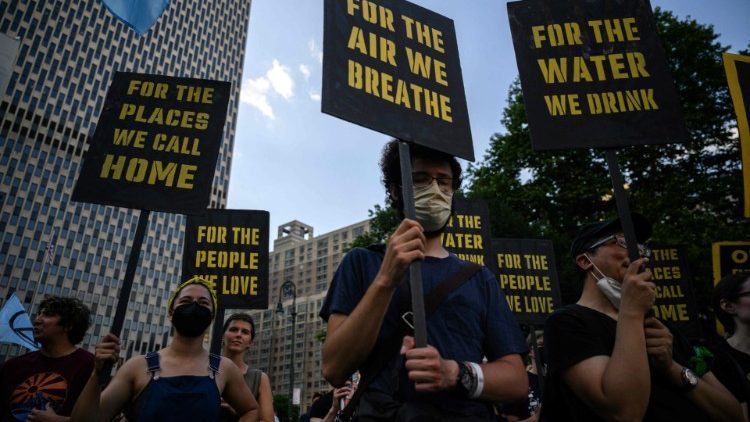 Climate activists attend a protest against a US Supreme Court ruling limiting government powers to curb greenhouse gases, in New York on June 30, 2022