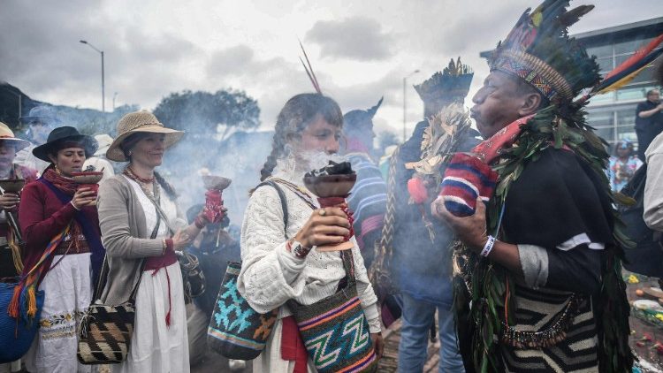 Indigenous people attend a ceremony in Colombia
