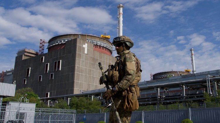 A Russian serviceman patrols near the nuclear power plant