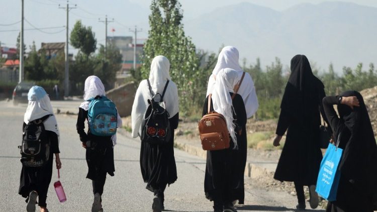 Girls walk to school in Afghanistan