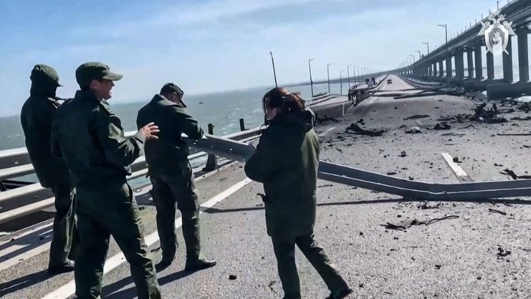Russian investigators working on the Kerch bridge -- linking Crimea to Russia -- which was heavily damaged following a truck explosion.