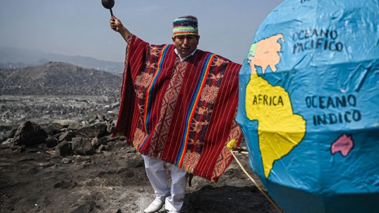A Peruvian shaman takes part in a ritual to deliver predictions for the upcoming Earth Day, on top of the San Cristobal hill in Lima