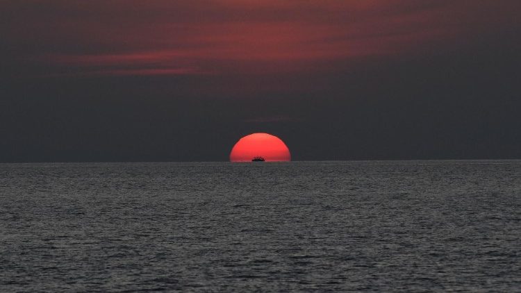 The sun sets over the Sulu sea in the Philippines. 
