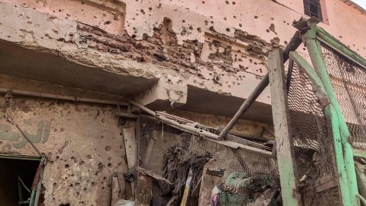 Bullet holes in the wall of a building at the Souk Sitta in Khartoum