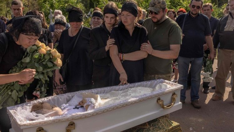 Ukrainians in mourning for the death of a six-year-old girl killed by Russian missile strike