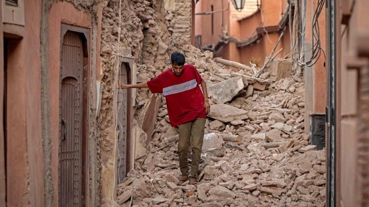 A Marrakesh resident walks amid rubble in the city's streets