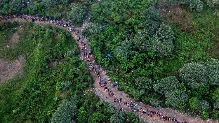 Aerial view showing migrants walking through the jungle near Bajo Chiquito village, the first border control of the Darien Province in Panama