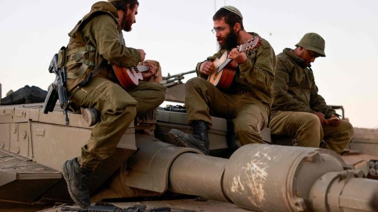 Israeli soldiers on the border with the Gaza Strip as a truce between Israel and Hamas entered a sixth day