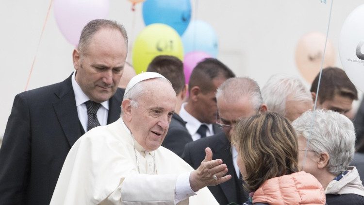 Pope Francis greets people at a General Audience