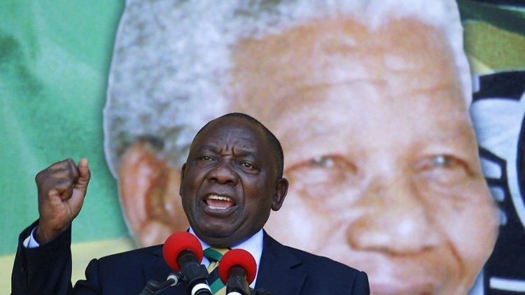 New South African President Cyril Ramaphosa addresses his supporters during a ceremony to mark 100 years from Mandela's birth